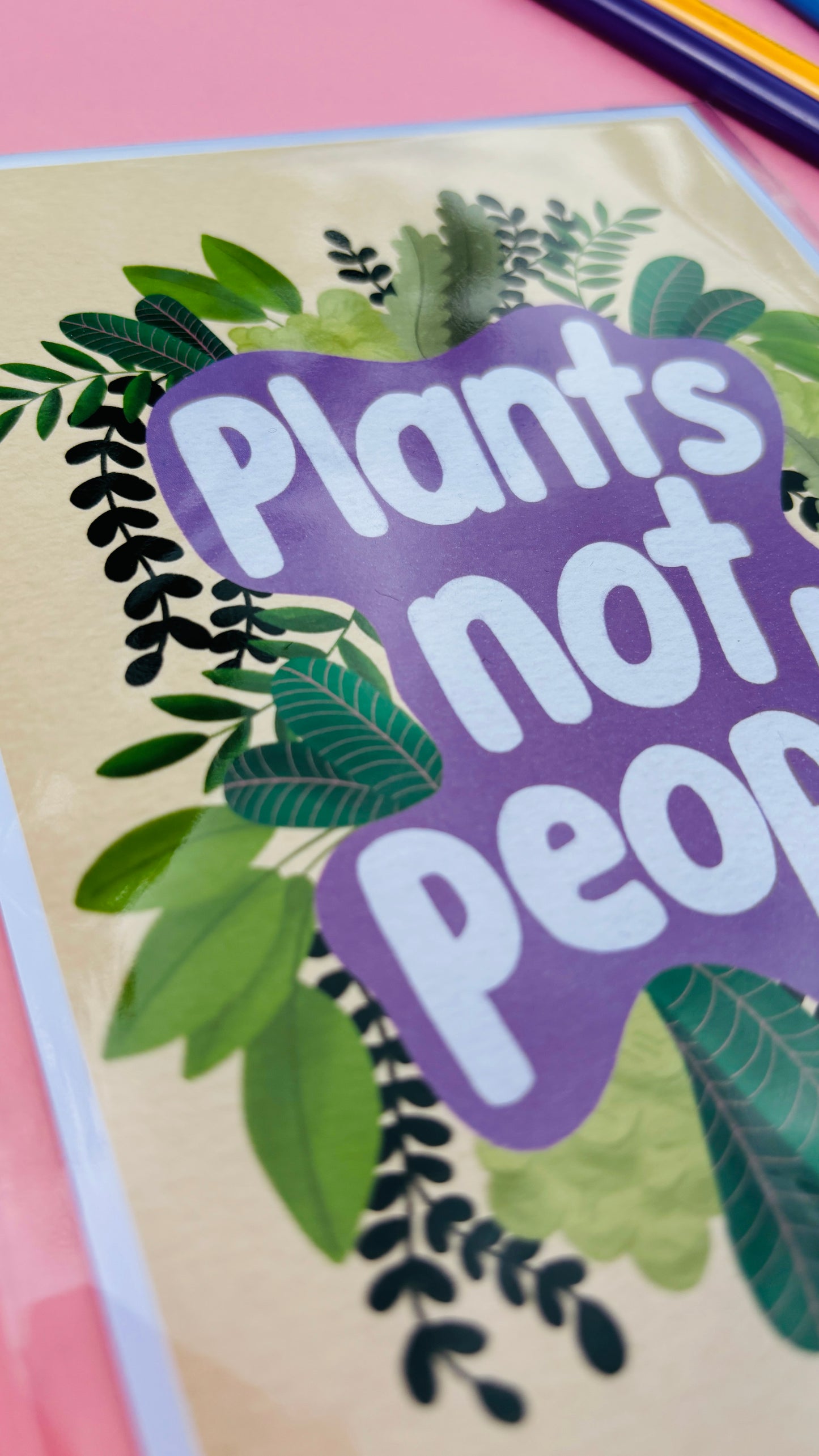 Funny wall art print for plant lovers. Reads plants not people I. Shite on a purple background surrounded by lush botanical plants.