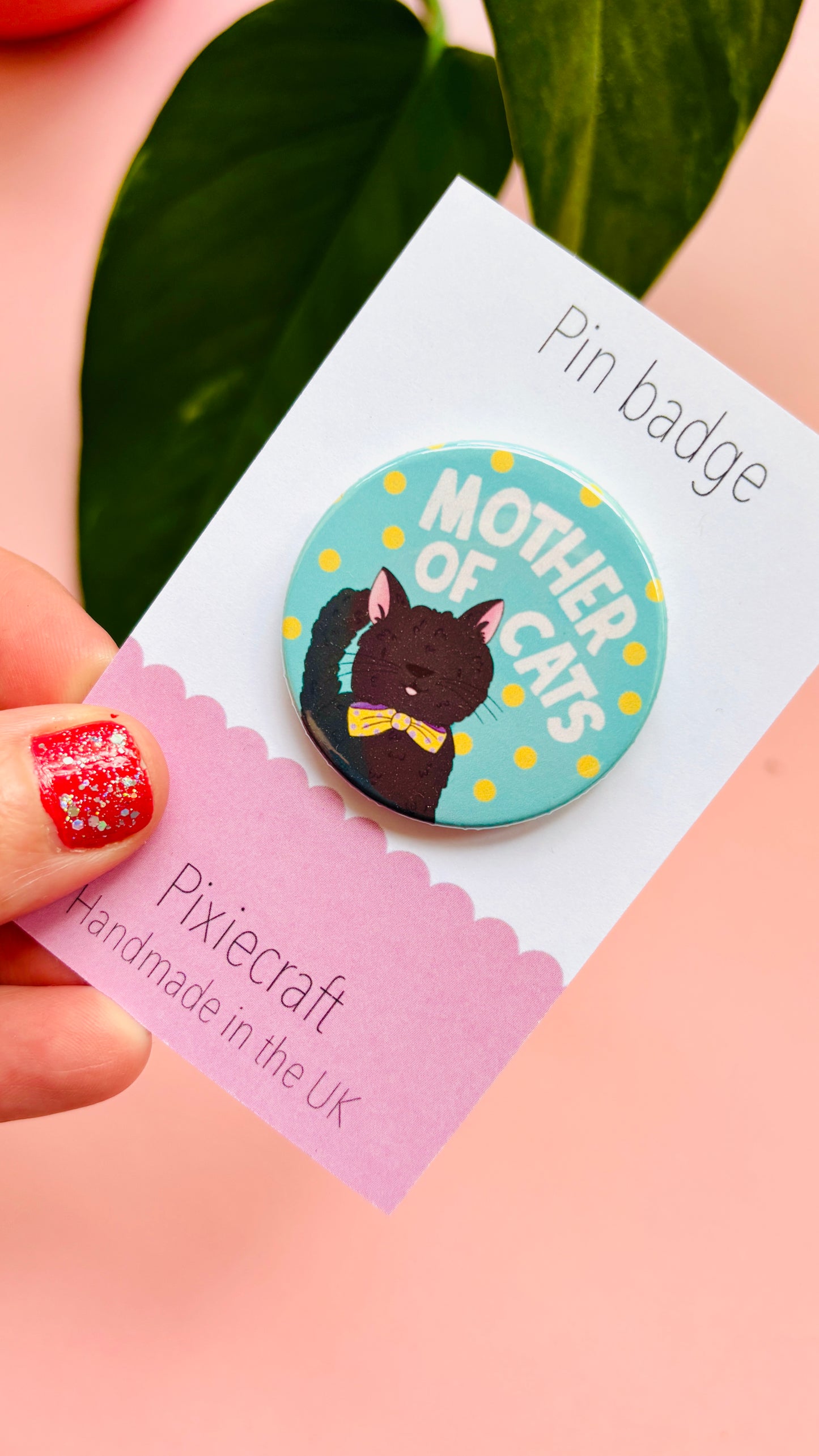 Handmade cat gift pin badge or fridge magnet. This cute accessory reads ‘mother of cats’ and you can choose from four different cat designs; brown tabby cat, orange/ginger cat, black cat, black and white cat. The hand drawn illustration is turned into a pin badge or magnet and presented on a colourful backing card ready for gifting. Great for stocking fillers.