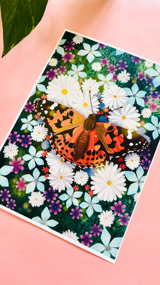 Colourful nature art print of a painted lady butterfly resting in a field of wildflowers. This beautiful illustration is perfect for lovers of nature, botanical illustration, wildflowers and cottagecore aesthetics. Illustrated and printed in the uk onto archival matte art paper and signed by the artist.