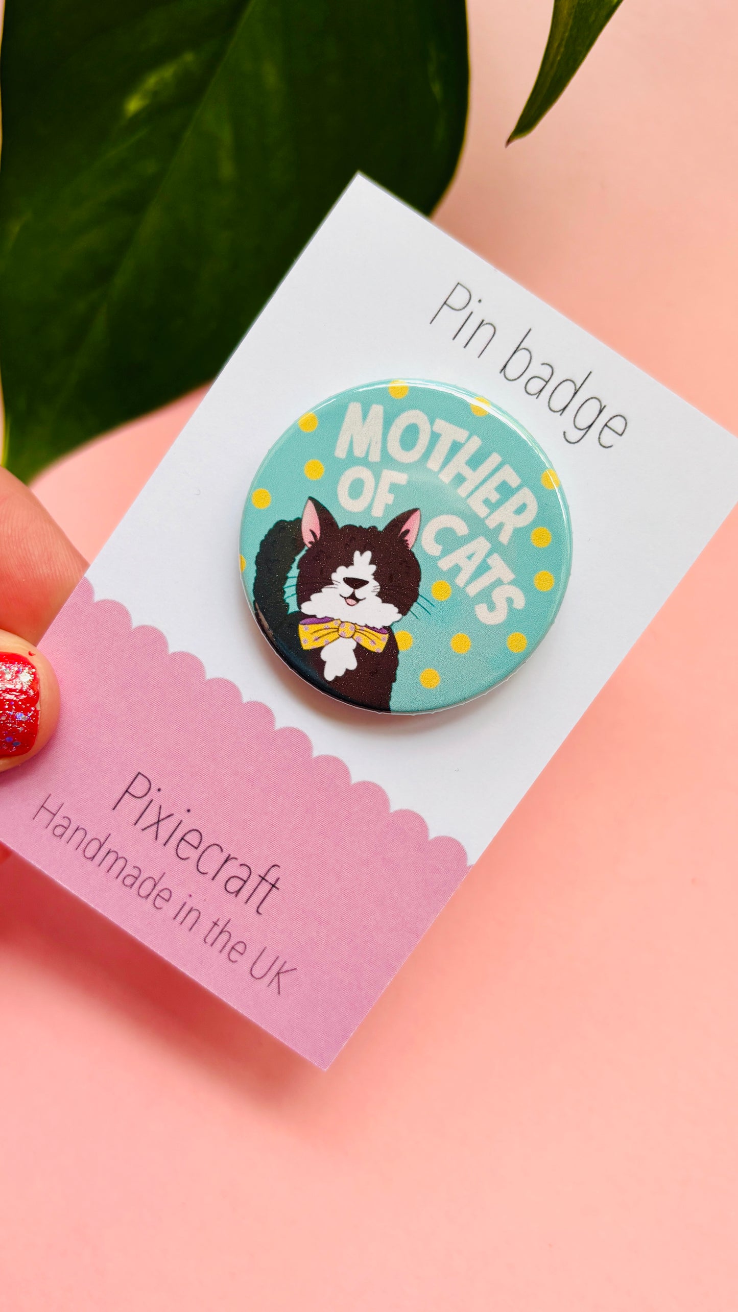 Handmade cat gift pin badge or fridge magnet. This cute accessory reads ‘mother of cats’ and you can choose from four different cat designs; brown tabby cat, orange/ginger cat, black cat, black and white cat. The hand drawn illustration is turned into a pin badge or magnet and presented on a colourful backing card ready for gifting. Great for stocking fillers.