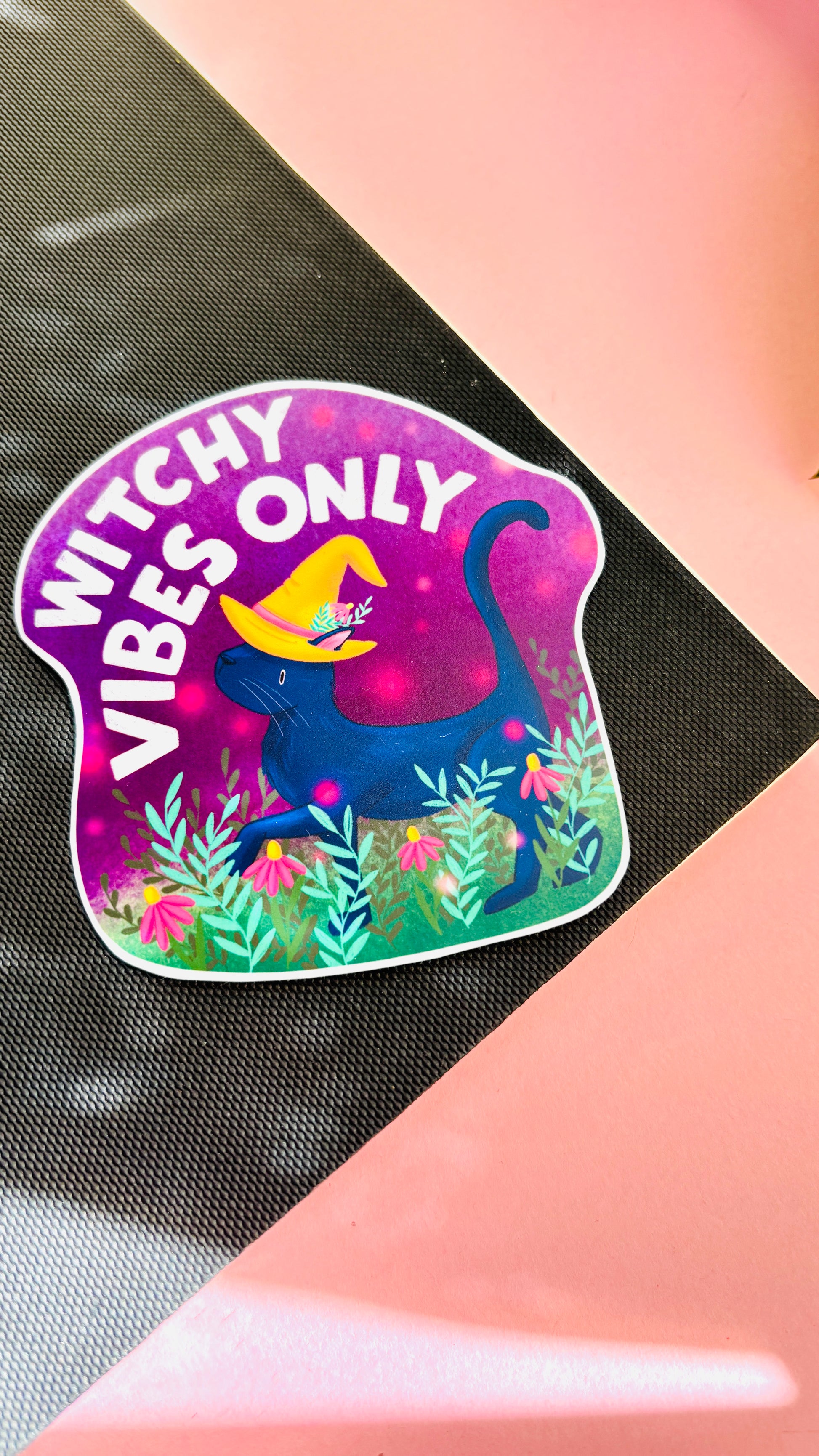 Halloween black cat vinyl sticker reading “Witchy Vibes Only,” hand-drawn with flowers, ideal for planners, water bottles, and notebooks.