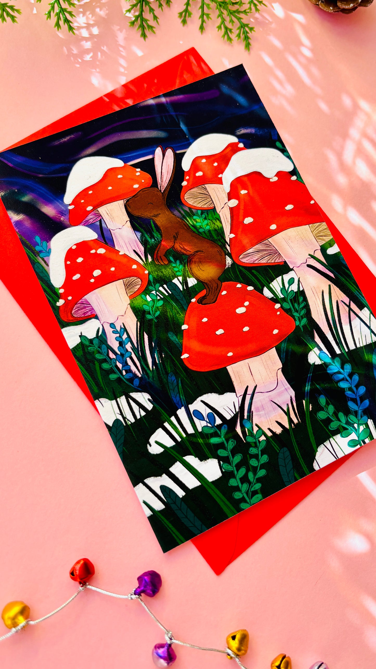 Whimsical woodland Christmas card with bunny and toadstool, eco-friendly festive greeting ideal for nature and forestcore lovers.