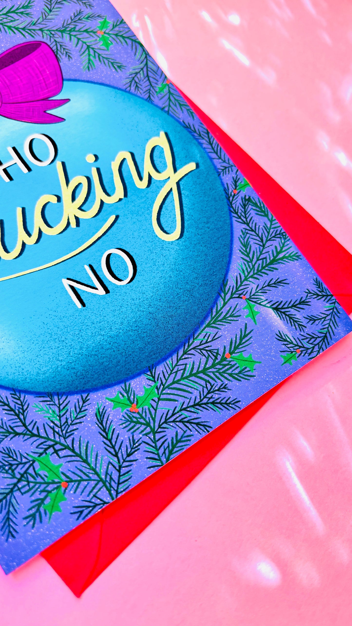 Funny adult Christmas card showing a bright blue bauble reading “Ho Fucking No,” hand-illustrated and cheeky festive design.