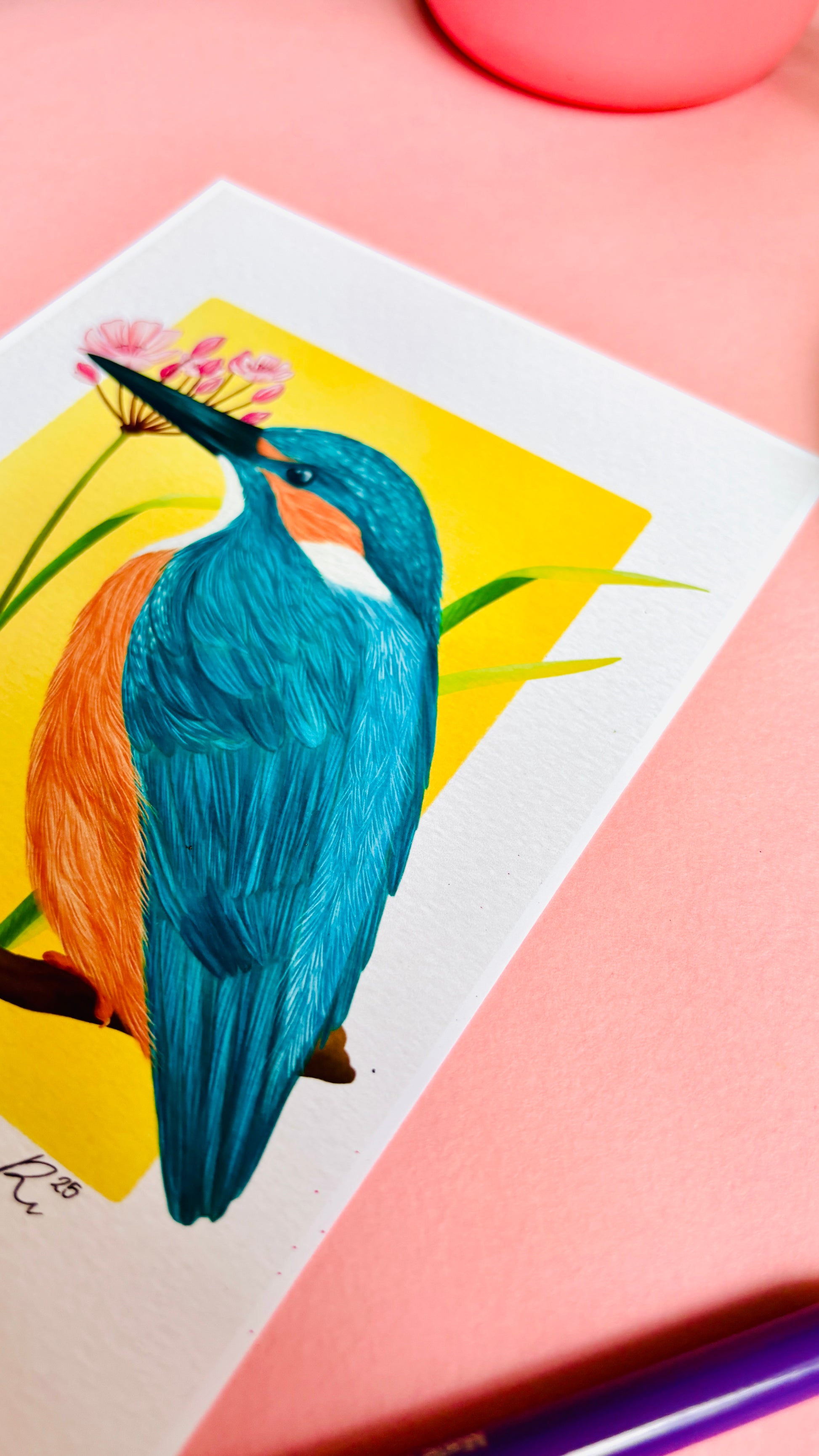 Kingfisher wildlife art print of a vibrant kingfisher bird and pink flowering rush plant inspired by British wildlife. Setting against a yellow backdrop this bold print is perfect for nature lovers, botanical illustration fans and maximalist decor. A beautiful gift for nature lovers.
