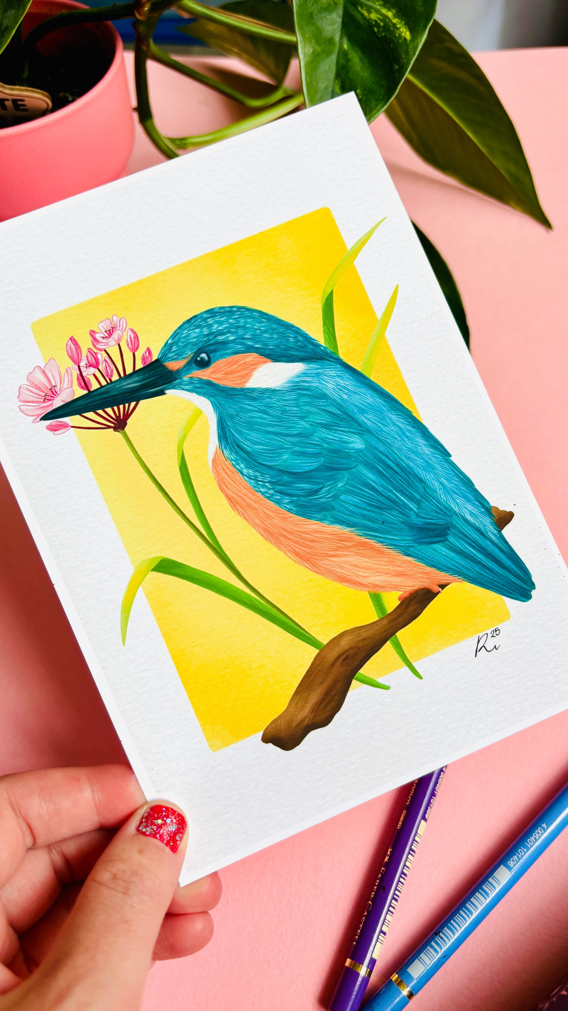 Kingfisher wildlife art print of a vibrant kingfisher bird and pink flowering rush plant inspired by British wildlife. Setting against a yellow backdrop this bold print is perfect for nature lovers, botanical illustration fans and maximalist decor. A beautiful gift for nature lovers.