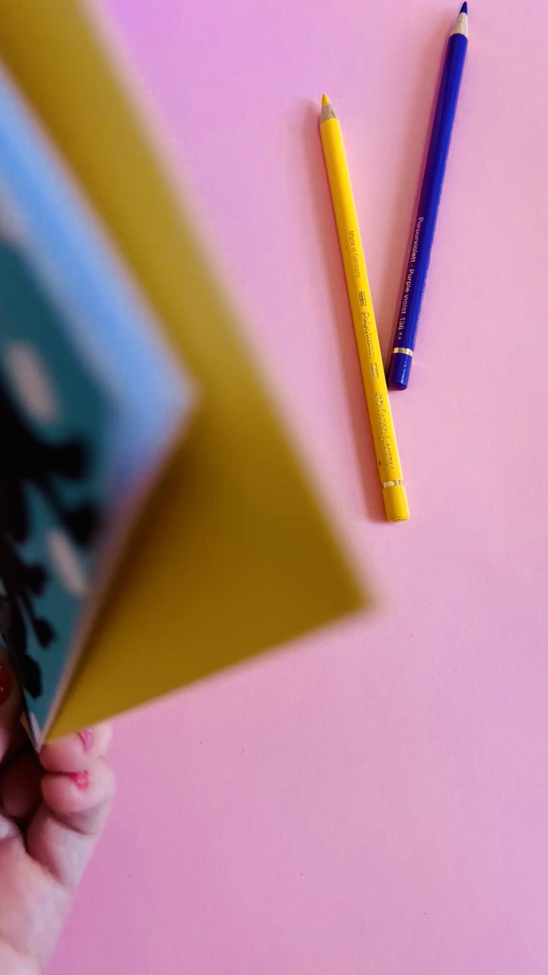 a colourful handmade ferret greetings card of a black and white ferret in a colourful party hat against a blue background with white polka dots