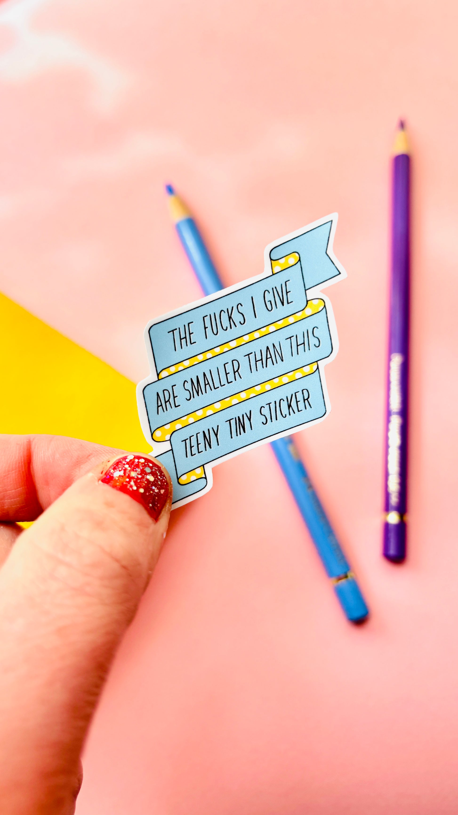 Sweary vinyl sticker quote that says “the fucks I give are smaller than this teeny tiny sticker” 
