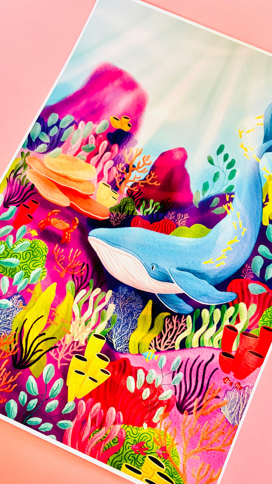 Ocean wall Art Print- colourful wall art of a blue whale and crab in a glittering blue sea surrounded by vibrant coral reef. Printed onto matte fine art paper and signed by the artist. Perfect for kids room decor, gallery walls, maximalist decor, coastal and beach decor 