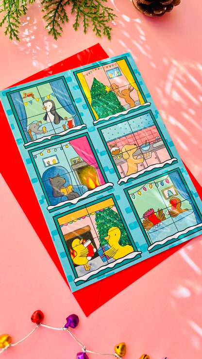 	Illustrated Christmas card designed like a festive building with animals in each window, including bunnies, penguins, a cat, a dog, robins, and ducks.