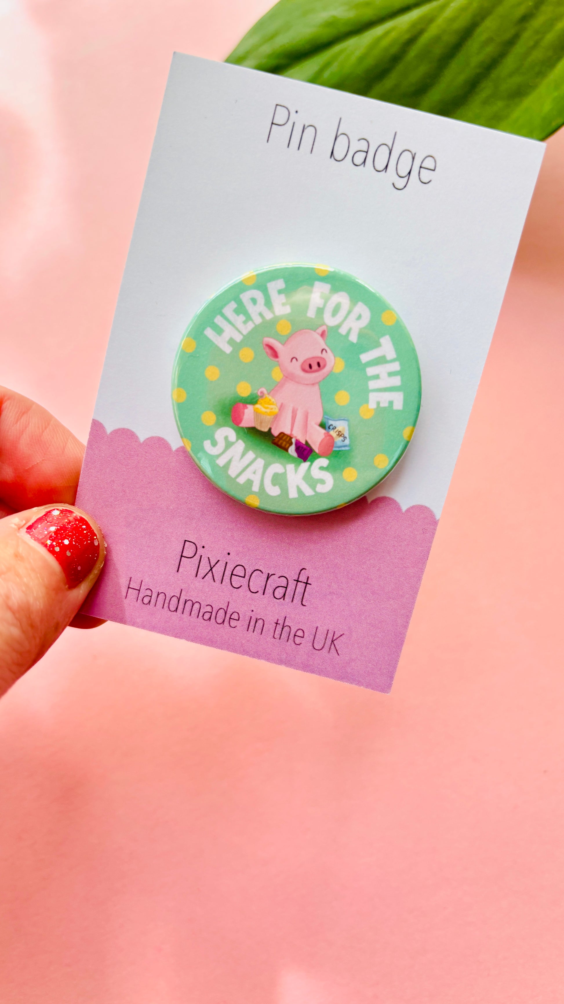 Cute pink pig badge surrounded by snacks, perfect for snack lovers and animal fans, available as magnet or pin.”
	3.	“Kawaii pig button badge with