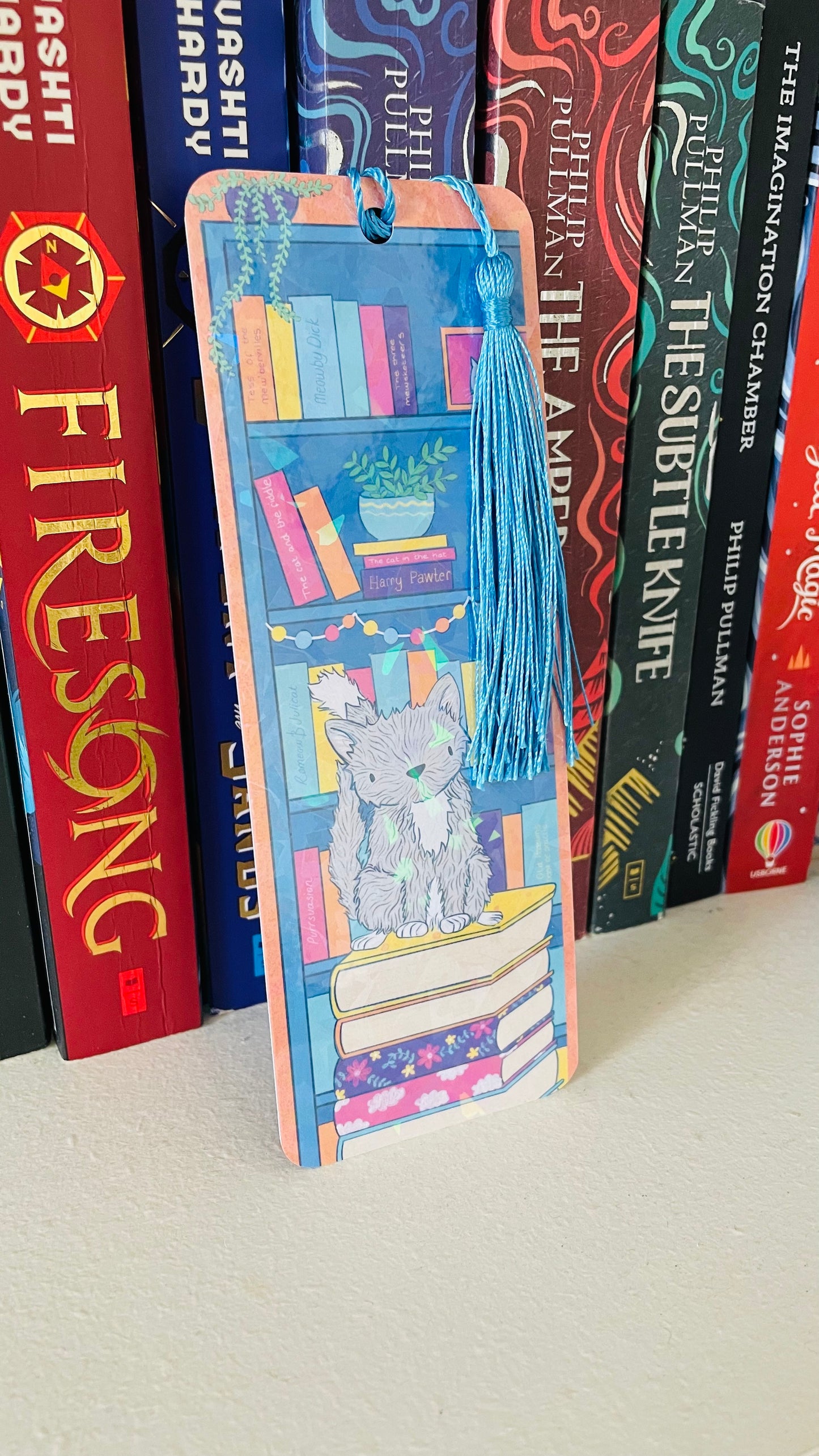 Cat and books illustrated rainbow bookmark