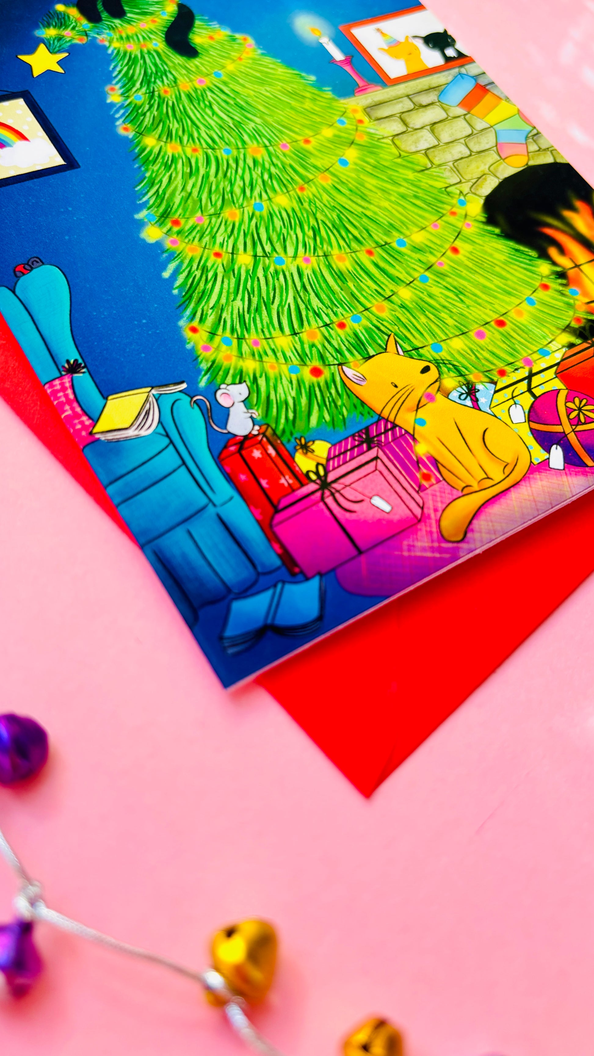 Handmade Christmas card with two playful cats by a decorated tree and fireplace, perfect festive greeting for cat lovers.