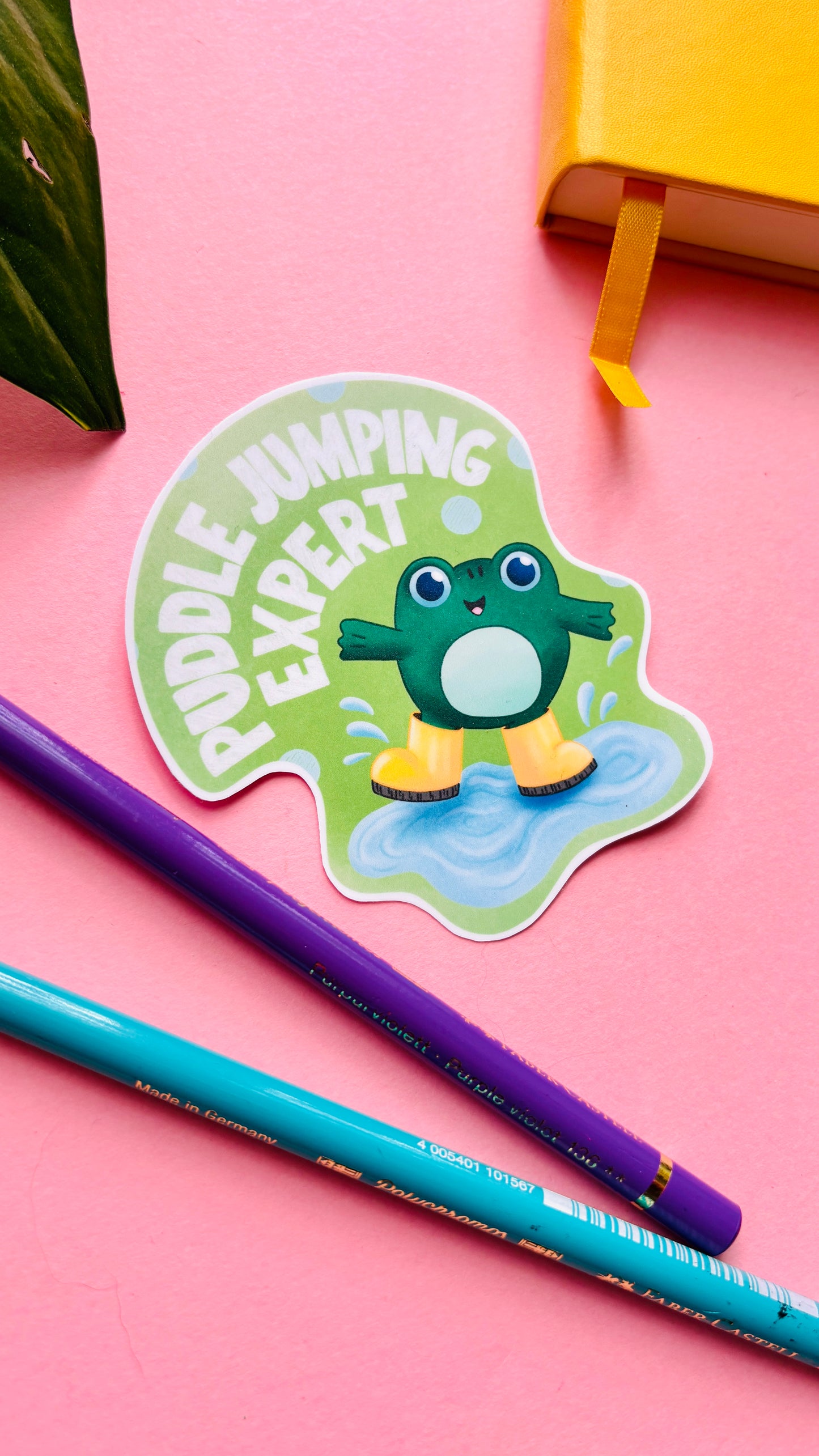 Puddle Jumping Club vinyl sticker with hand-drawn frog in wellies splashing in a puddle, fun nature-inspired sticker