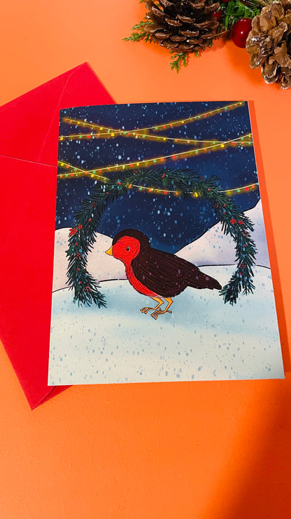 Robin illustrated Christmas card of a robin under a festive garland. Digitally illustrated 