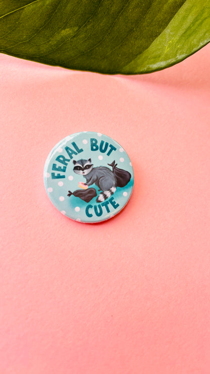 Handmade “Feral but Cute” raccoon badge or magnet – cute illustrated wildlife gift for animal lovers and nature fans.