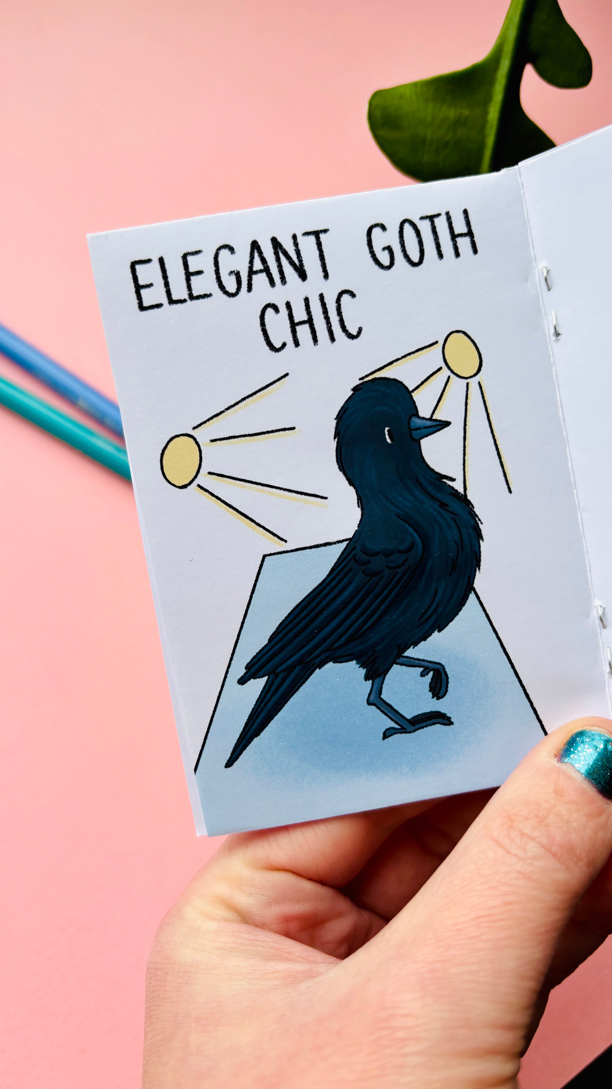 Reasons to Be a Crow zine shown as a small illustrated bird gift