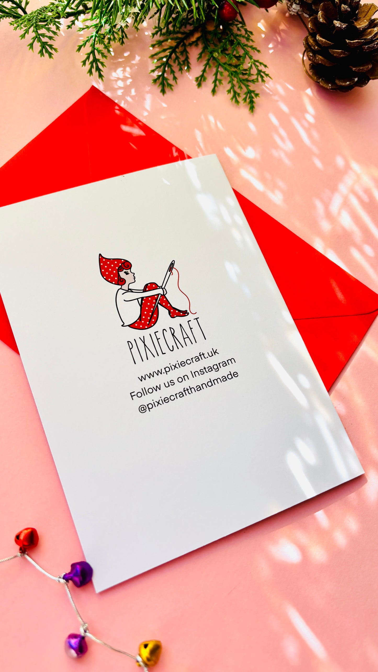 White product packaging with a logo and text on a pink and red striped background with decorative elements.