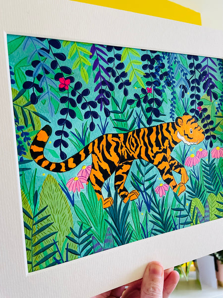 Colourful painting of a bright orange tiger between many plants and leaves