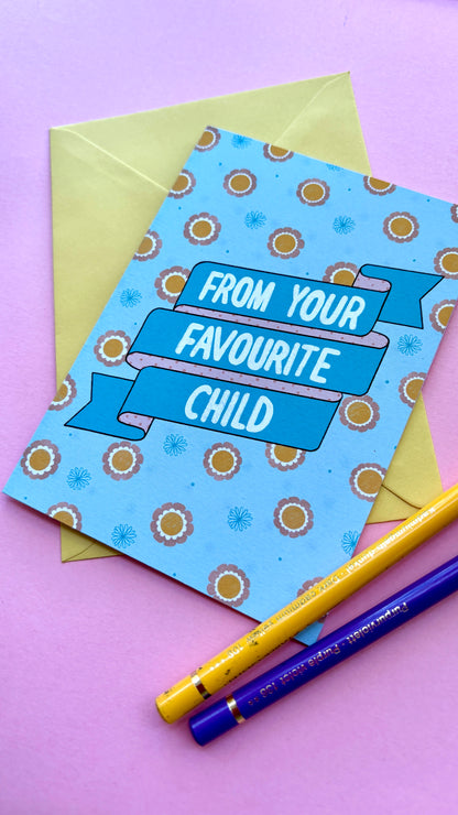 A funny handmade greetings card for mum or dad and reads “from your favourite child” on a blue and pink banner against a colourful retro feel floral background. Supplied with a yellow envelope.