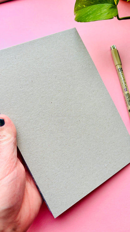 Back view of Nature themed A5 lined notepad with illustrated pigeon and robin, colourful indie stationery