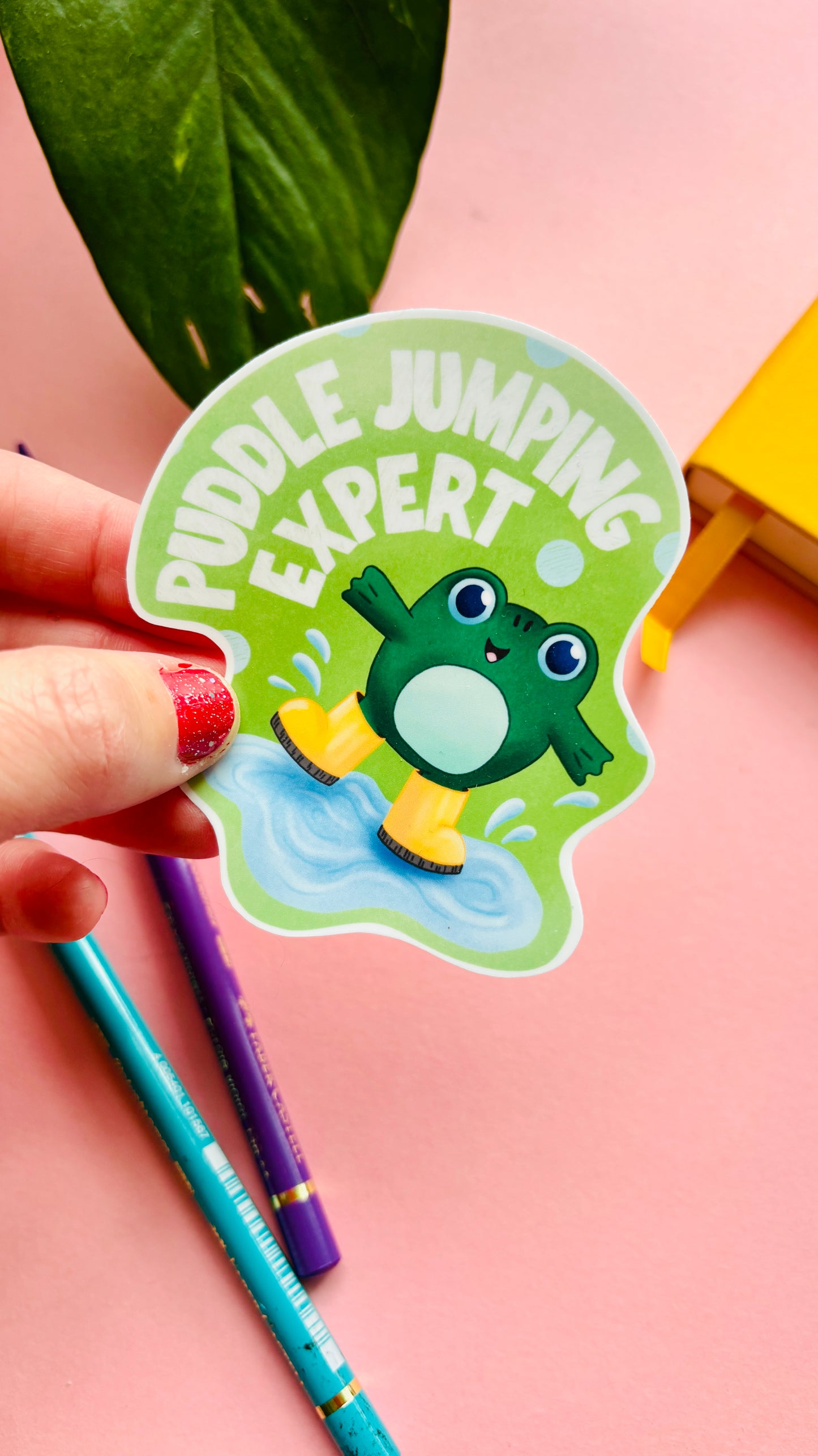 Puddle Jumping Club vinyl sticker with hand-drawn frog in wellies splashing in a puddle, fun nature-inspired sticker