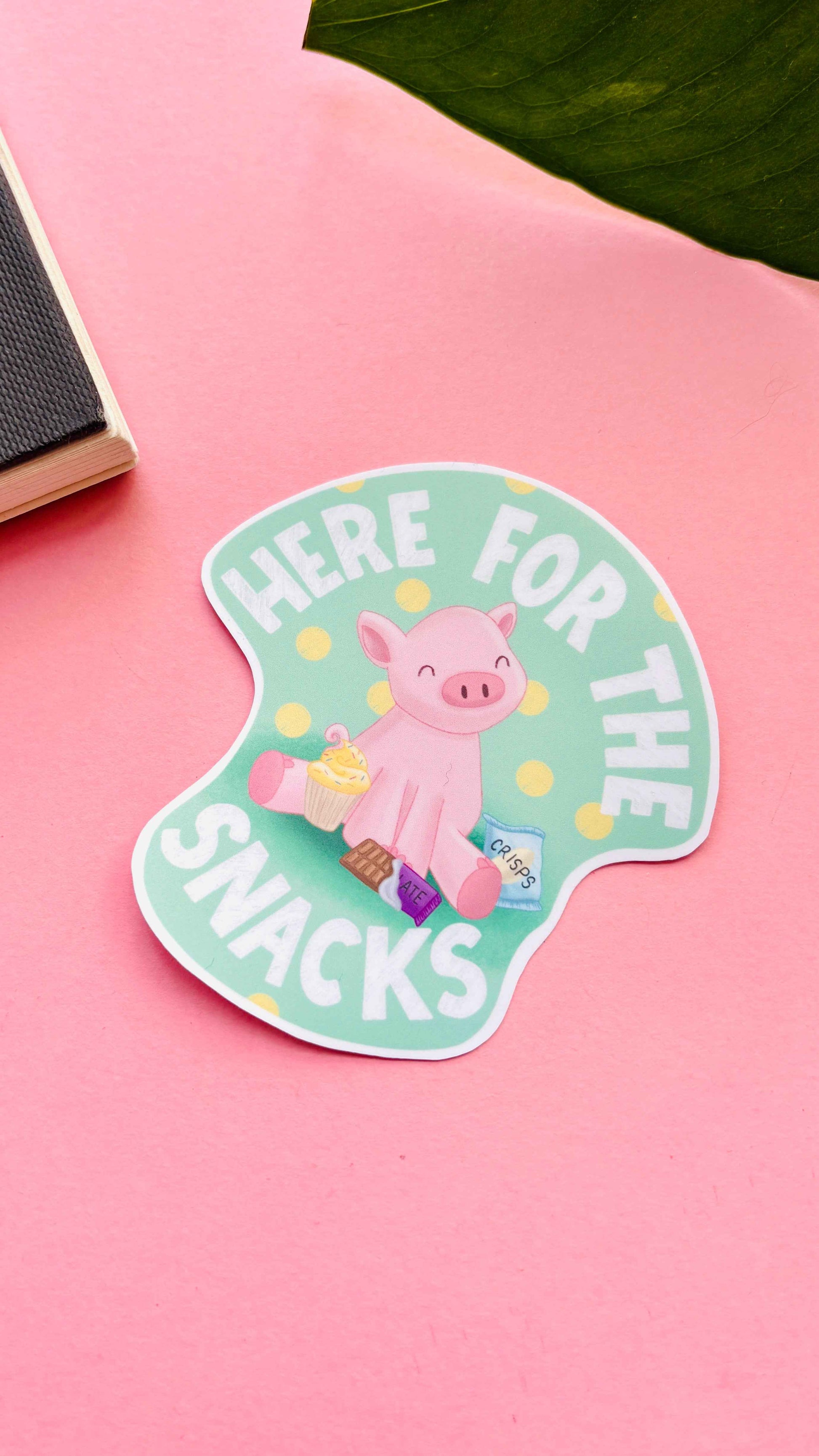 “Here for the Snacks” sticker – playful pig surrounded by treats, handmade and durable for personalising laptops or bottles.
