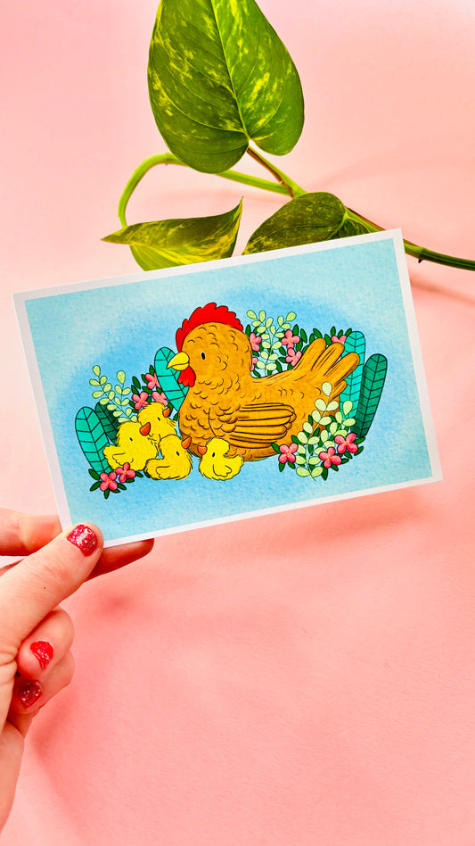 a Cute mini art print of a mother hen and her fluffy chicks in front of spring plants and flowers on a blue background