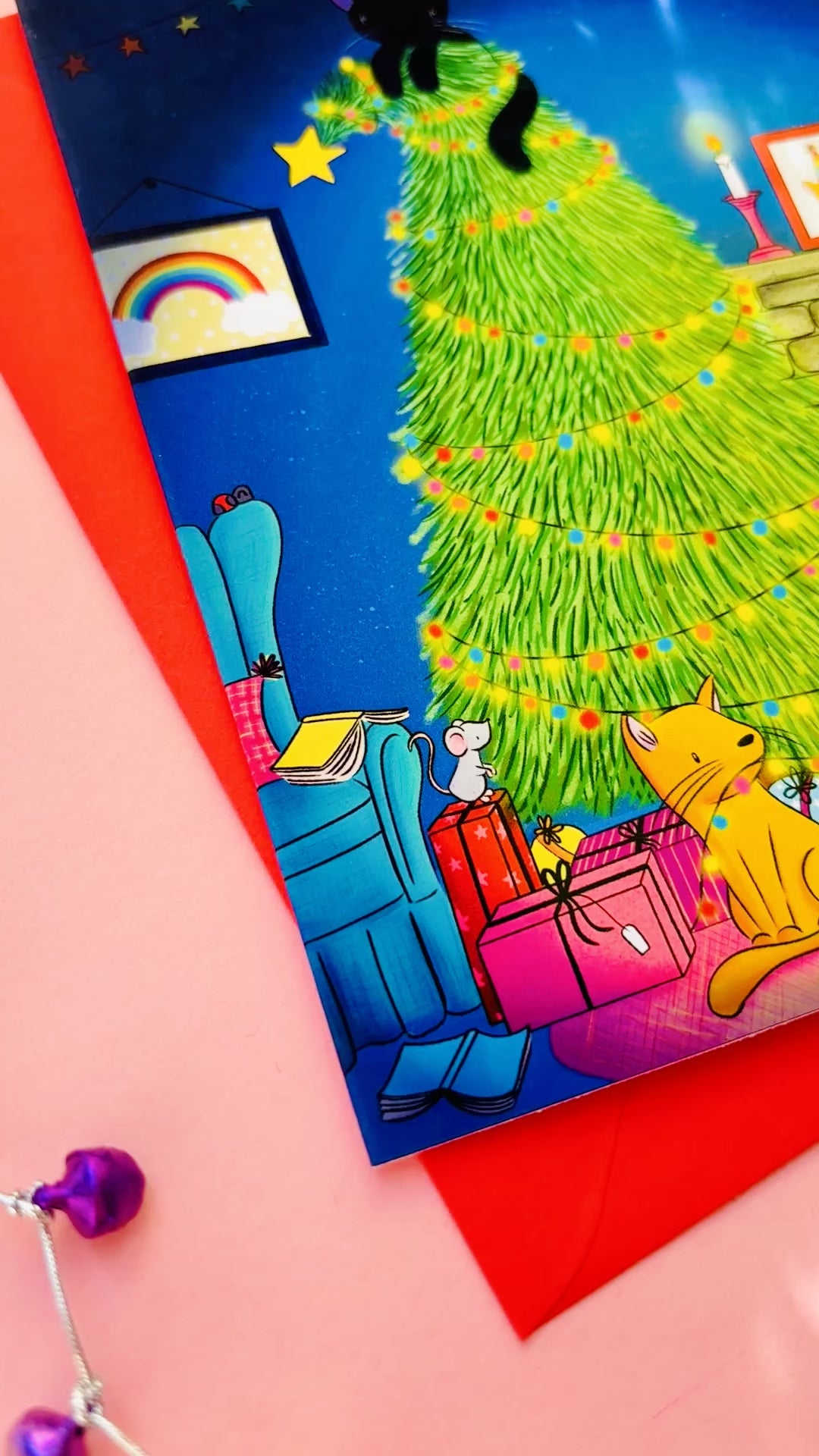 Handmade Christmas card with two playful cats by a decorated tree and fireplace, perfect festive greeting for cat lovers.