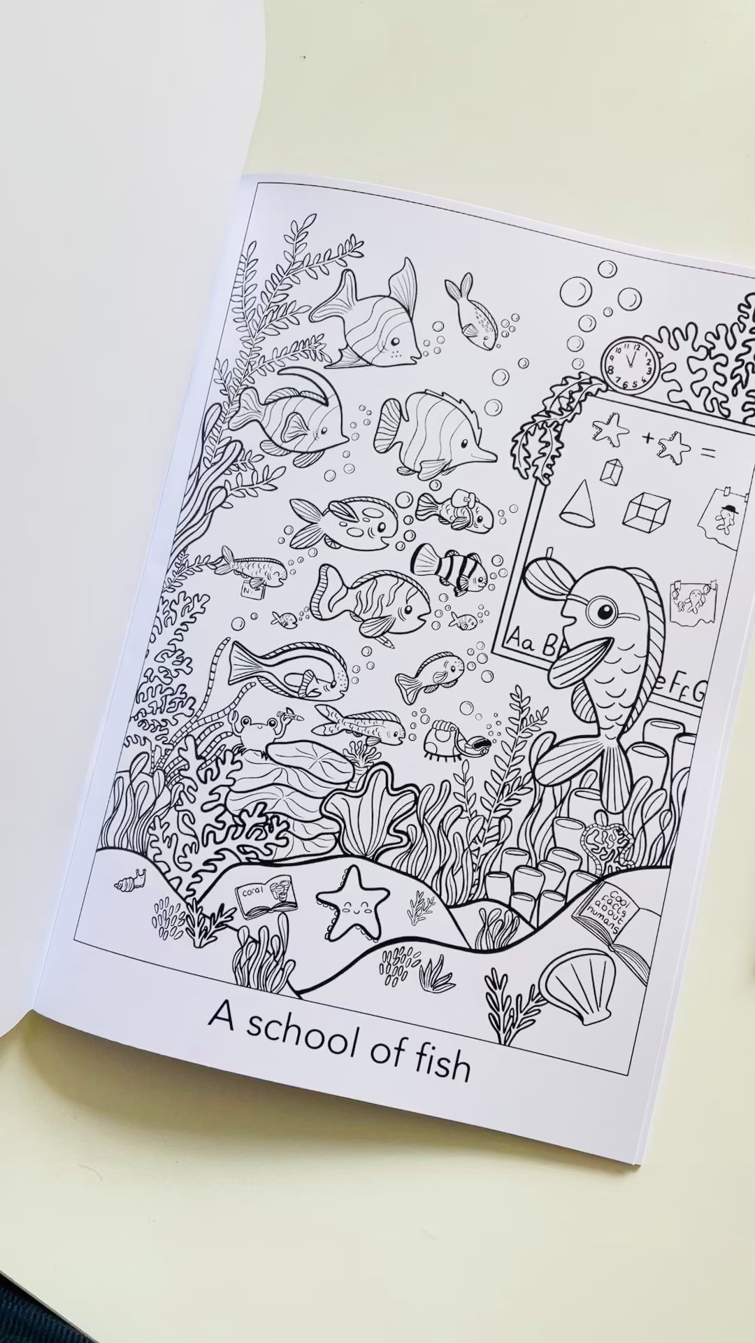 A school of fish illustrated colouring page