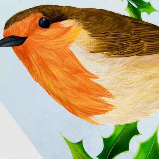 Robin art print for nature lovers. Nature inspired wall art ideal for Christmas decor as this beautiful bird illustration features a red breast robin sat atop a log against a holly backdrop. 