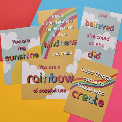 Five colourful postcards with inspirational quotes on a colourful background. They have clouds and rainbow backgrounds