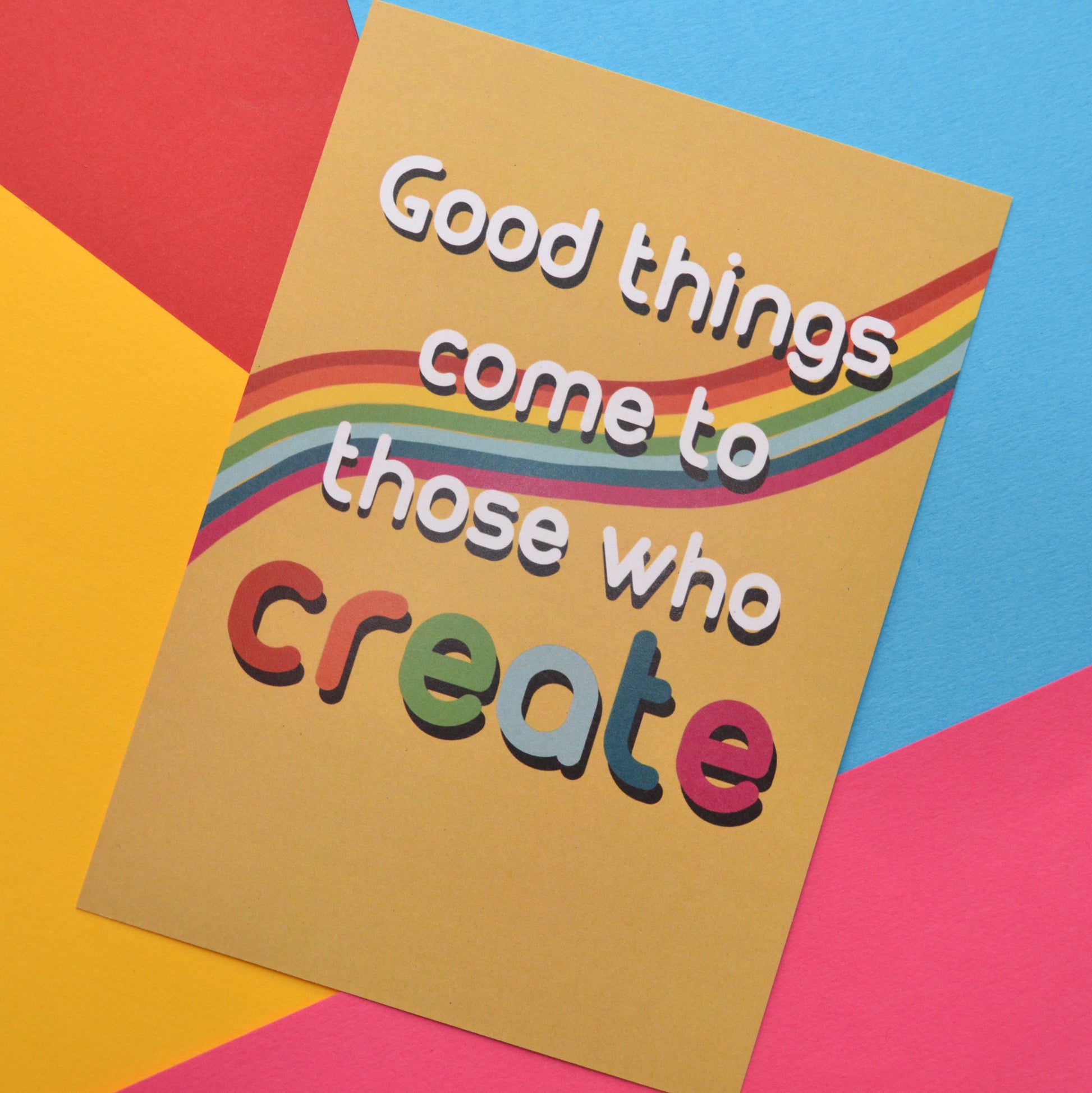 Good things come to those who create in white and rainbow colours on a yellow and rainbow background